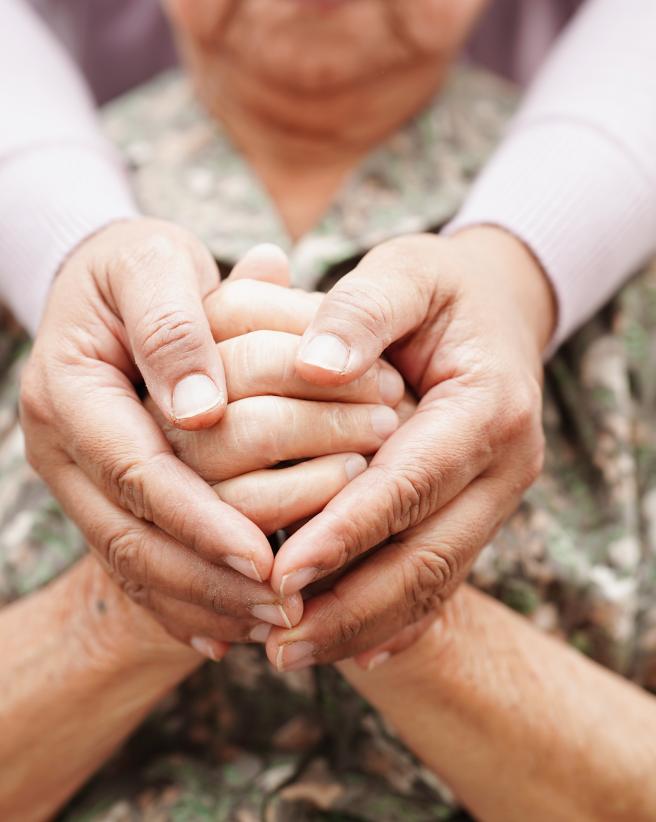 two sets of hands holding each other