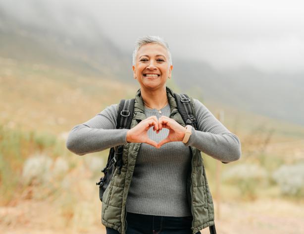 woman with hands in the shape of a heart