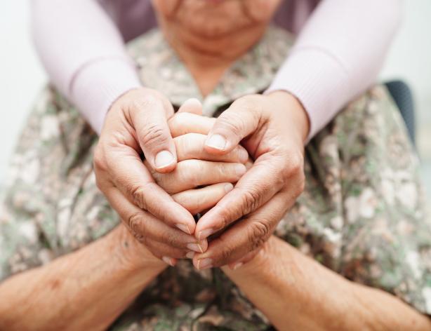 two sets of hands holding each other