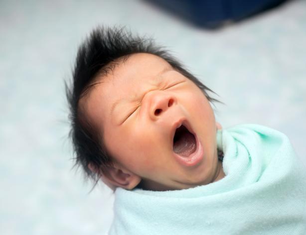 Newborn yawning